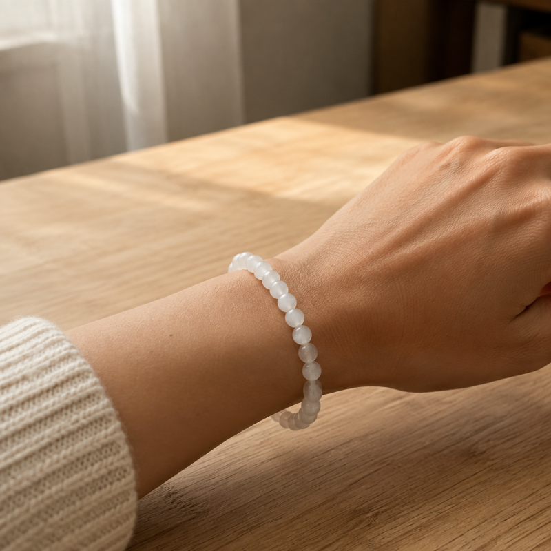 Moonlit White bracelet worn as a single strand