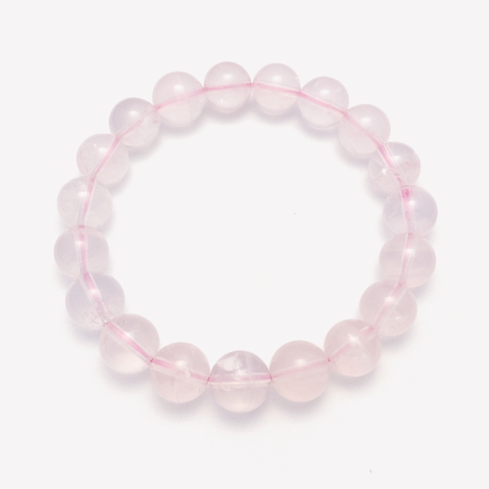 Clear quartz bracelet with a single rose-toned focal bead